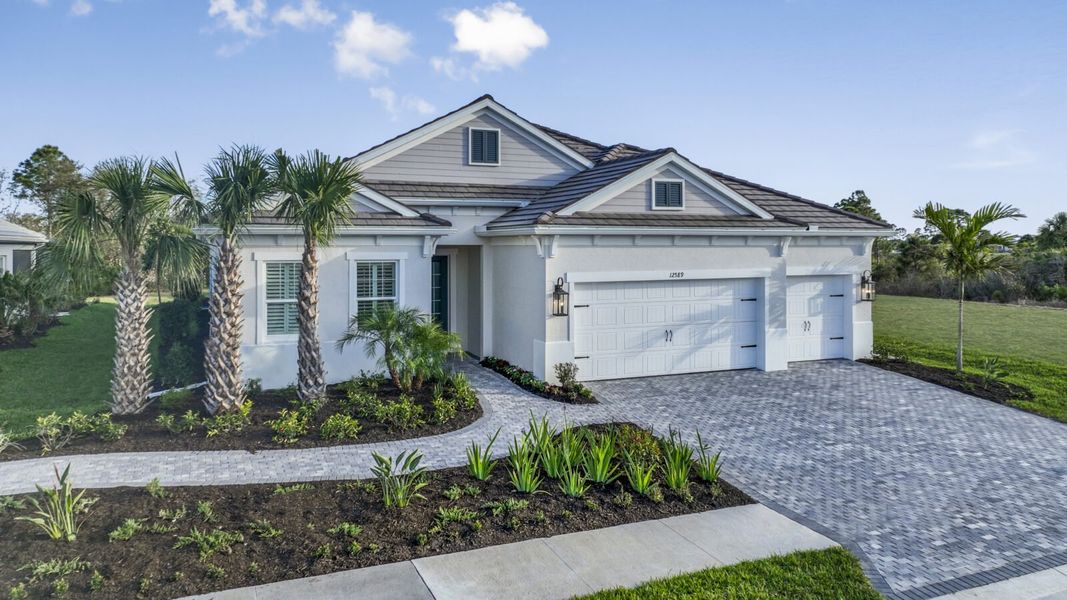 Front exterior of a new home in Avelina, Venice, FL, highlighting curb appeal (Image 23).