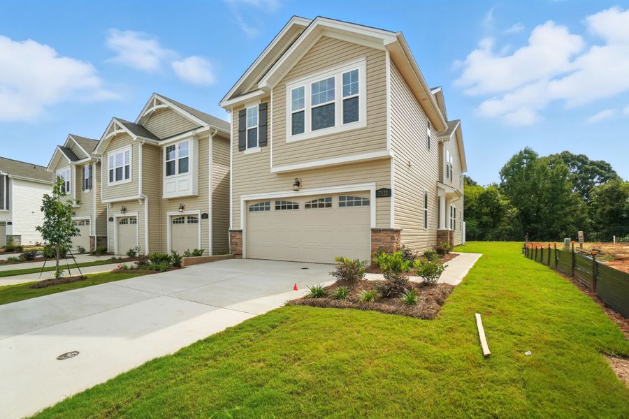 Front exterior of a new home in Bailey Run, Charlotte, NC, highlighting curb appeal (Image 1). Front exterior of a new home in Bailey Run, Charlotte, NC, highlighting curb appeal (Image 1).