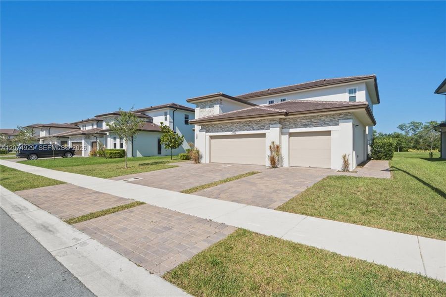Front exterior of a new home in , Davie, FL, highlighting curb appeal (Image 19). Front exterior of a new home in , Davie, FL, highlighting curb appeal (Image 19).