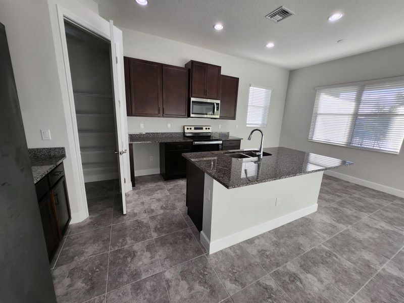 Furnished interior view inside a new home in , The Acreage (Image 6).