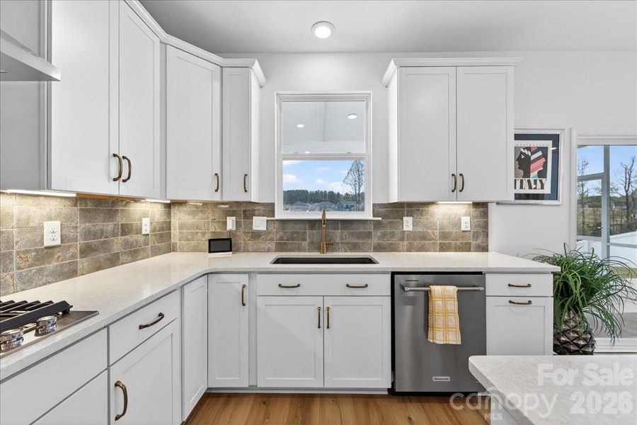 Tons of cabinets are a plus and a window over the sink are a wonderful touch.