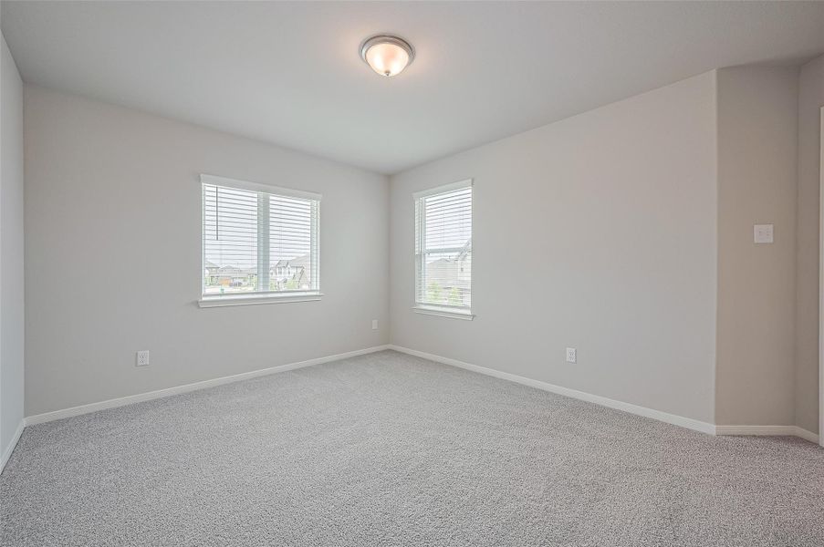 Spacious, unfurnished interior of a new home in Sunterra, Katy (Image 24).