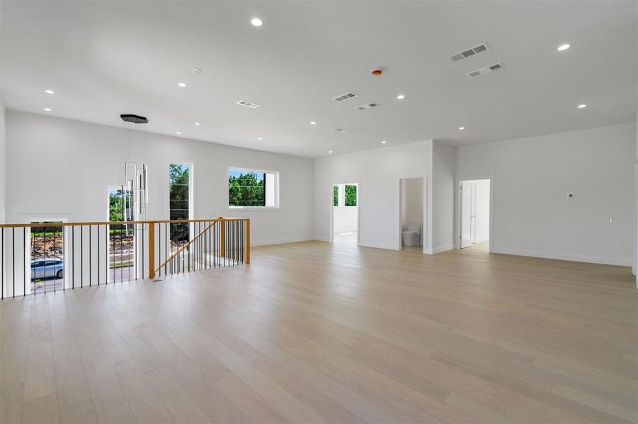 Unfurnished room featuring recessed lighting, light wood finished floors, and visible vents