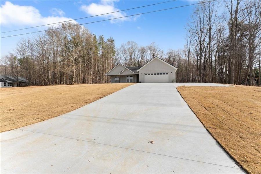 Front exterior of a new home in , Cleveland, GA, highlighting curb appeal (Image 30). Front exterior of a new home in , Cleveland, GA, highlighting curb appeal (Image 30).