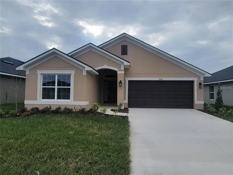 Front exterior of a new home in Abbey Glen, Dade City, FL, highlighting curb appeal (Image 1). Front exterior of a new home in Abbey Glen, Dade City, FL, highlighting curb appeal (Image 1).