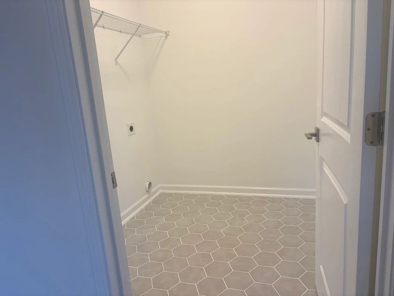 Laundry Room featuring the AW Collection® Milan - Functional with flair, featuring sleek shelving.