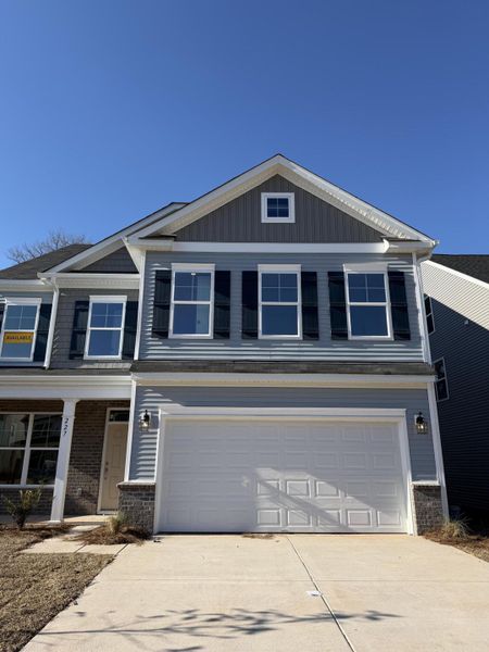 Front exterior of a new home in Parker's Preserve, Ridgeville, SC, highlighting curb appeal (Image 1). Front exterior of a new home in Parker's Preserve, Ridgeville, SC, highlighting curb appeal (Image 1).