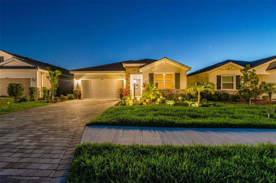 Front exterior of a new home in Star Farms at Lakewood Ranch, Bradenton, FL, highlighting curb appeal (Image 29).