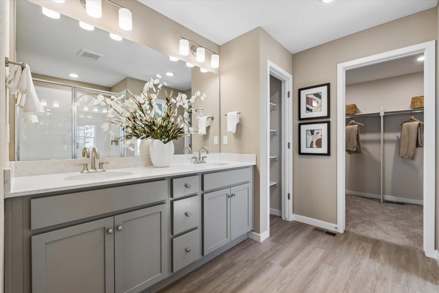 A bathroom with a large mirror.