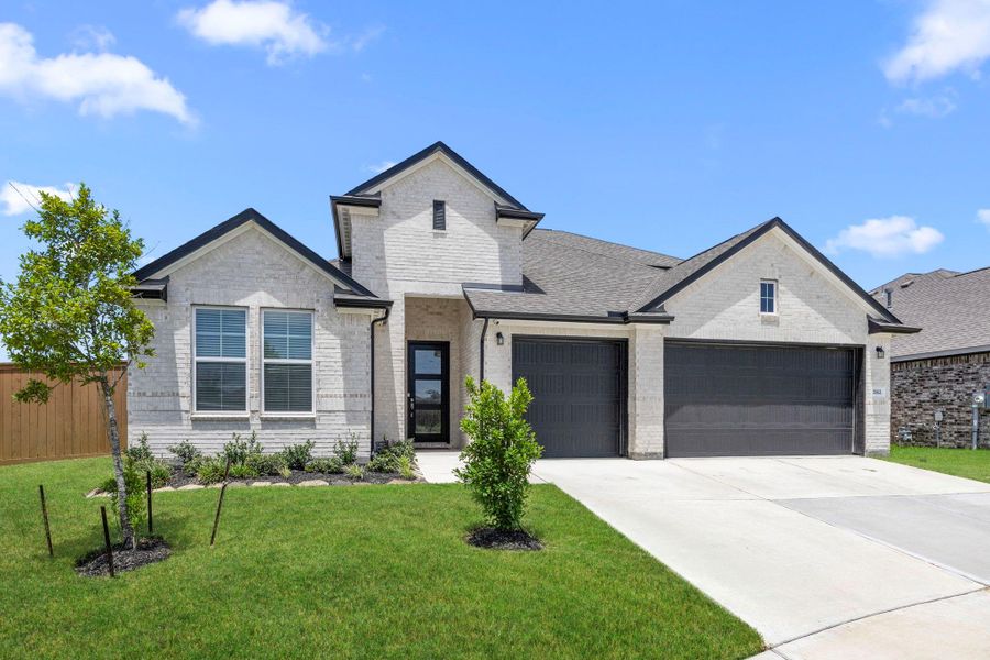 Front exterior of a new home in , Santa Fe, TX, highlighting curb appeal (Image 20).