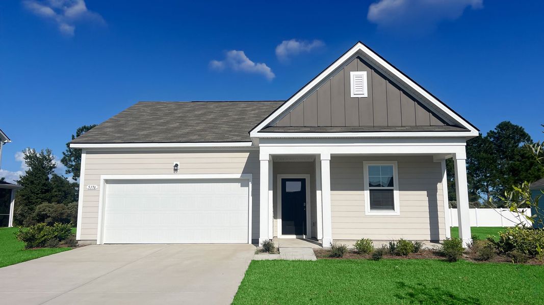Front exterior of a new home in Auberon Woods, Conway, SC, highlighting curb appeal (Image 1).