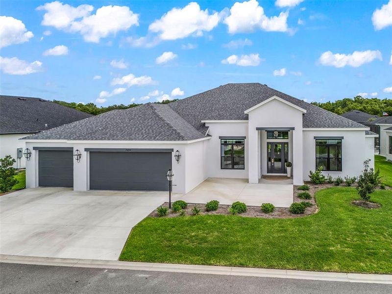 Front exterior of a new home in , The Villages, FL, highlighting curb appeal (Image 2). Front exterior of a new home in , The Villages, FL, highlighting curb appeal (Image 2).