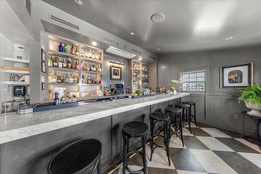 Charming neighborhood bar moments from The Linden, offering a warm, intimate setting for cocktails and casual evenings out.