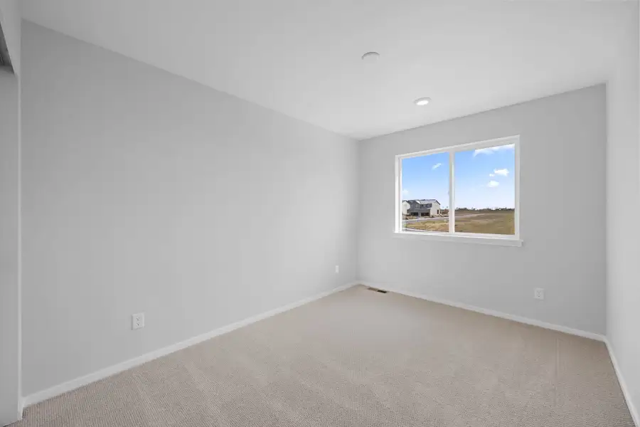 Spacious, unfurnished interior of a new home in Sky Ranch, Watkins (Image 44).