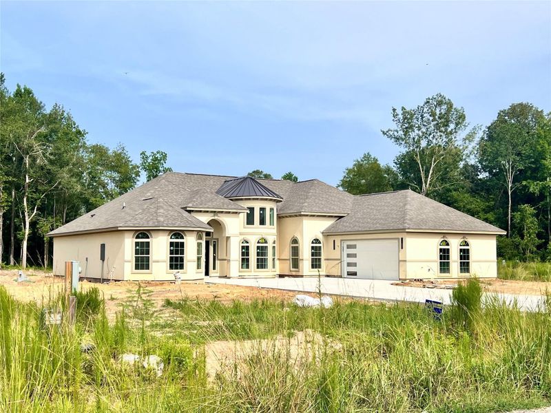 Front exterior of a new home in , Dayton, TX, highlighting curb appeal (Image 23).