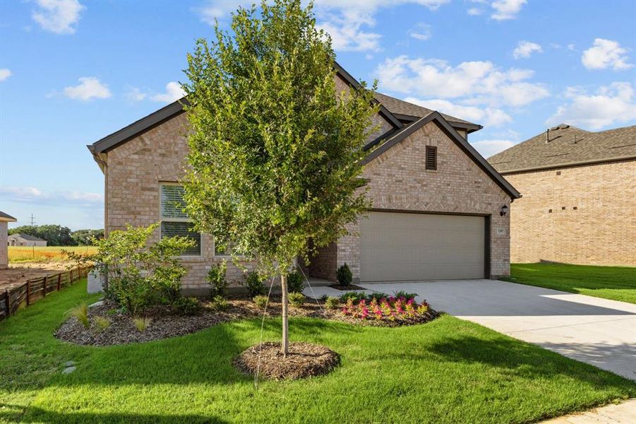 Front exterior of a new home in Kings Way, Denton, TX, highlighting curb appeal (Image 2). Front exterior of a new home in Kings Way, Denton, TX, highlighting curb appeal (Image 2).