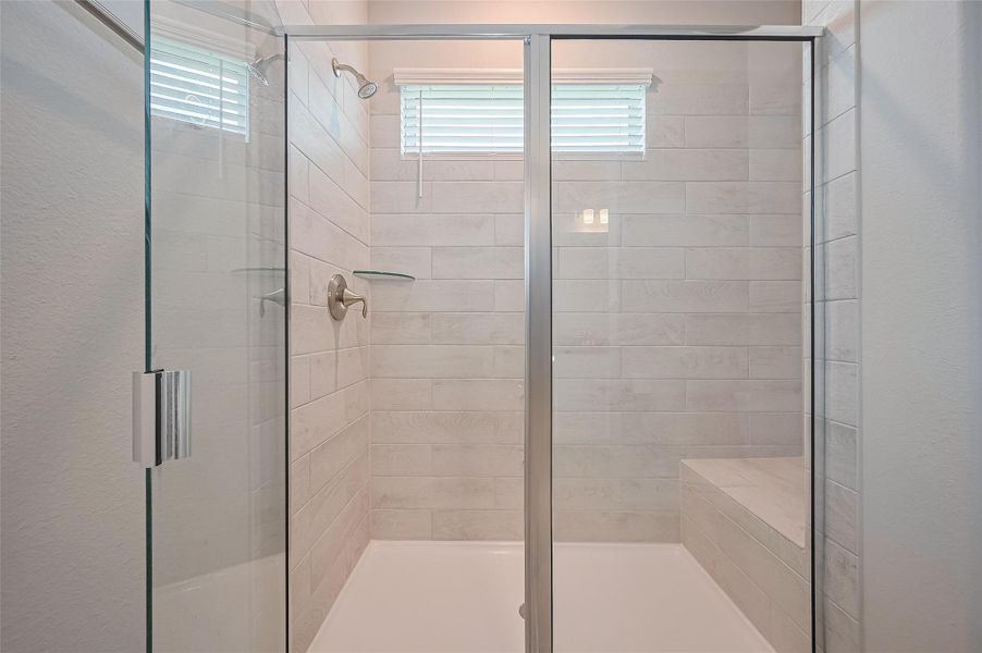 Furnished interior view inside a new home in Sunterra, Katy (Image 27).