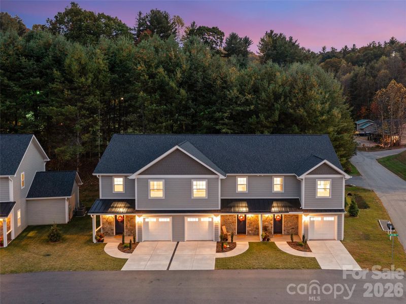 Front exterior of a new home in , Burnsville, NC, highlighting curb appeal (Image 24).