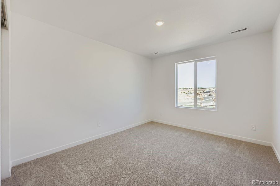 Spacious, unfurnished interior of a new home in Percheron: The Explorer Collection, Colorado Springs (Image 7).