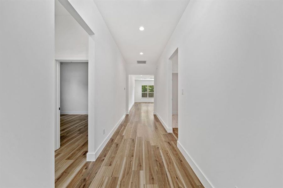 Hall featuring light wood-type flooring