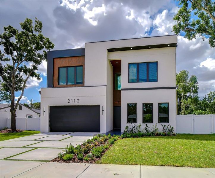 Front exterior of a new home in , Tampa, FL, highlighting curb appeal (Image 27).