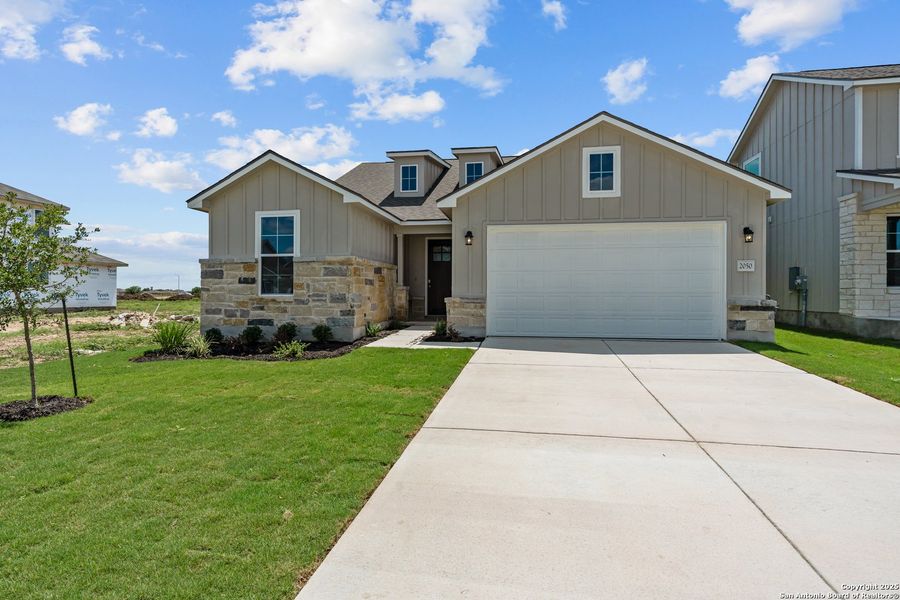 Front exterior of a new home in Weltner Farms 50’s, New Braunfels, TX, highlighting curb appeal (Image 20).