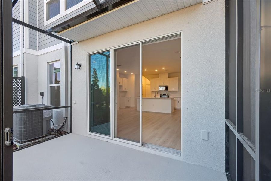 Exterior details and patio area of a home in North River Ranch – Townhomes, Parrish (Image 3).