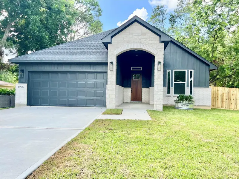 Front exterior of a new home in , Santa Fe, TX, highlighting curb appeal (Image 24).