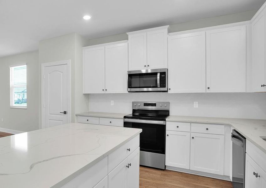 The kitchen is chef-ready with stainless steel appliances included!