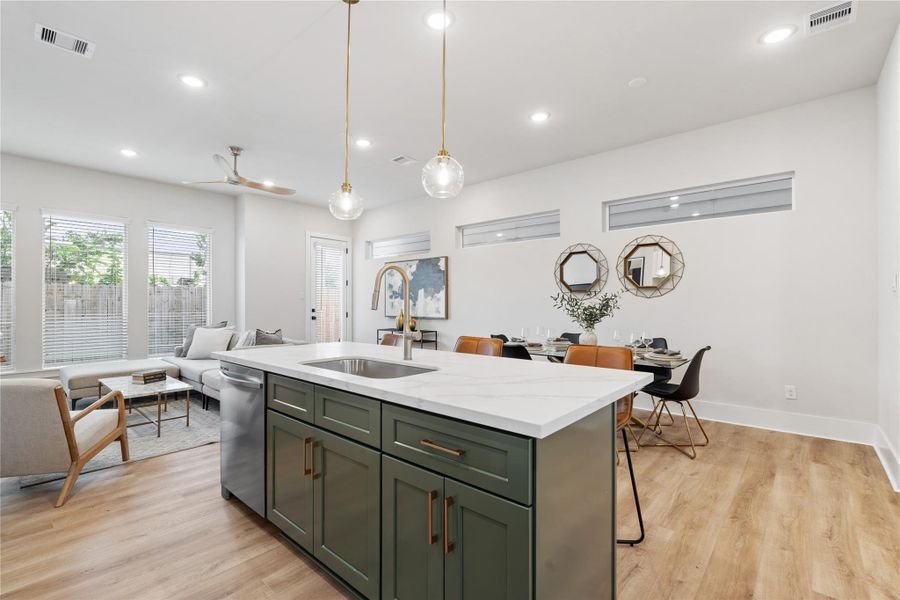 Designed for gathering, the kitchen naturally becomes the center of the home, where the island invites conversation and every detail supports effortless hosting.