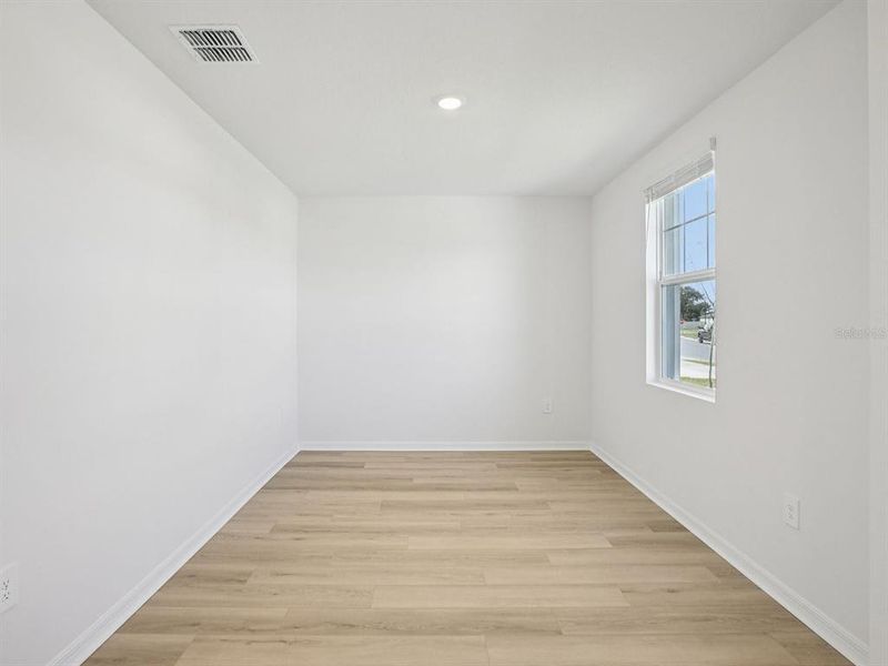 Spacious, unfurnished interior of a new home in The Grove at Stuart Crossing - Classic Series, Bartow (Image 30).