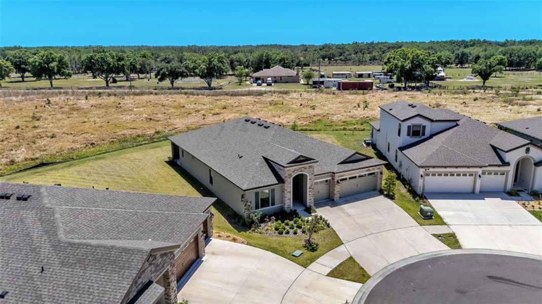 Front exterior of a new home in Hawkstone, Lithia, FL, highlighting curb appeal (Image 29).