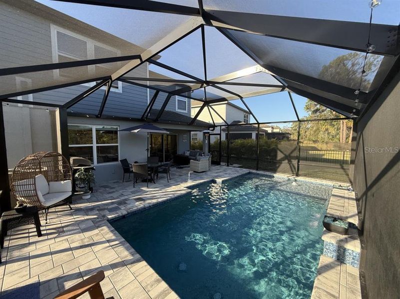 Exterior details and patio area of a home in Isles at BayView, Parrish (Image 3).
