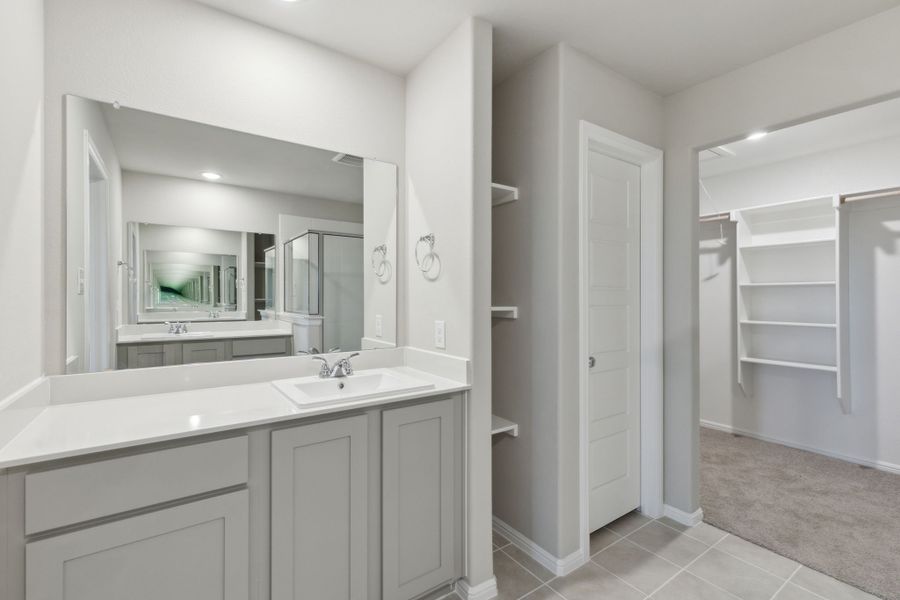 Primary Bathroom in the Harrison home plan by Trophy Signature Homes – REPRESENTATIVE PHOTO