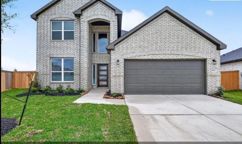 Front exterior of a new home in Enclave at Willis, Katy, TX, highlighting curb appeal (Image 1). Front exterior of a new home in Enclave at Willis, Katy, TX, highlighting curb appeal (Image 1).
