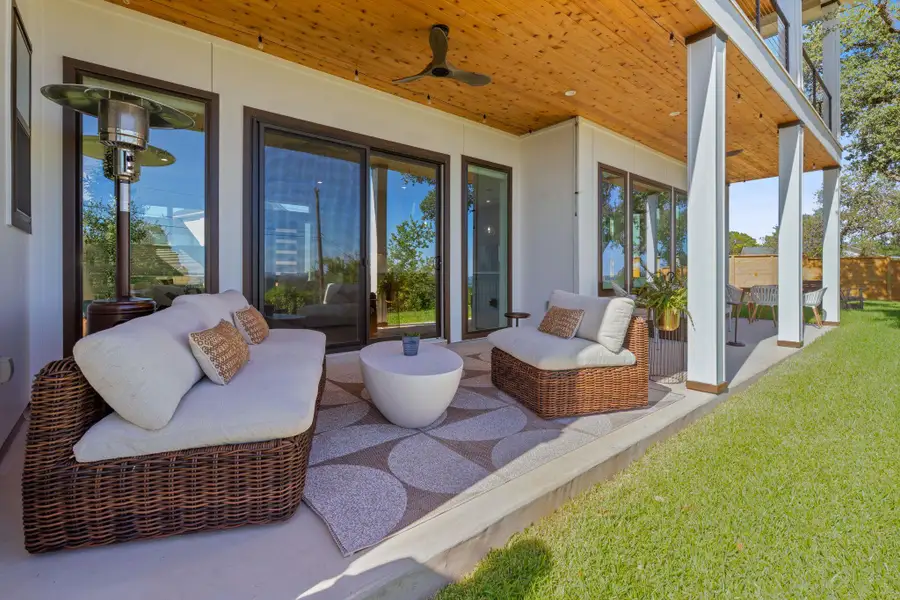 More room to relax, wide covered patio, cozy seating, and Lake Travis, Hill Country views in the background. Great for entertaining. More room to relax, wide covered patio, cozy seating, and Lake Travis, Hill Country views in the background. Great for entertaining.