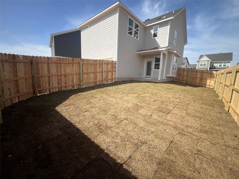 Exterior details and patio area of a home in Lariat, Liberty Hill (Image 12).