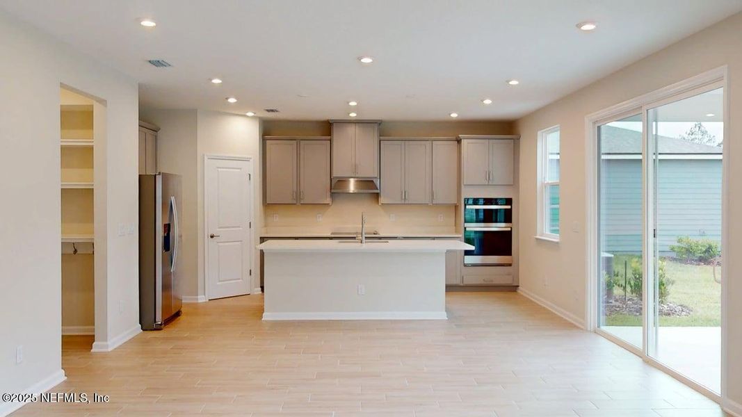 Furnished interior view inside a new home in Lakes at Bella Lago, Green Cove Springs (Image 8).