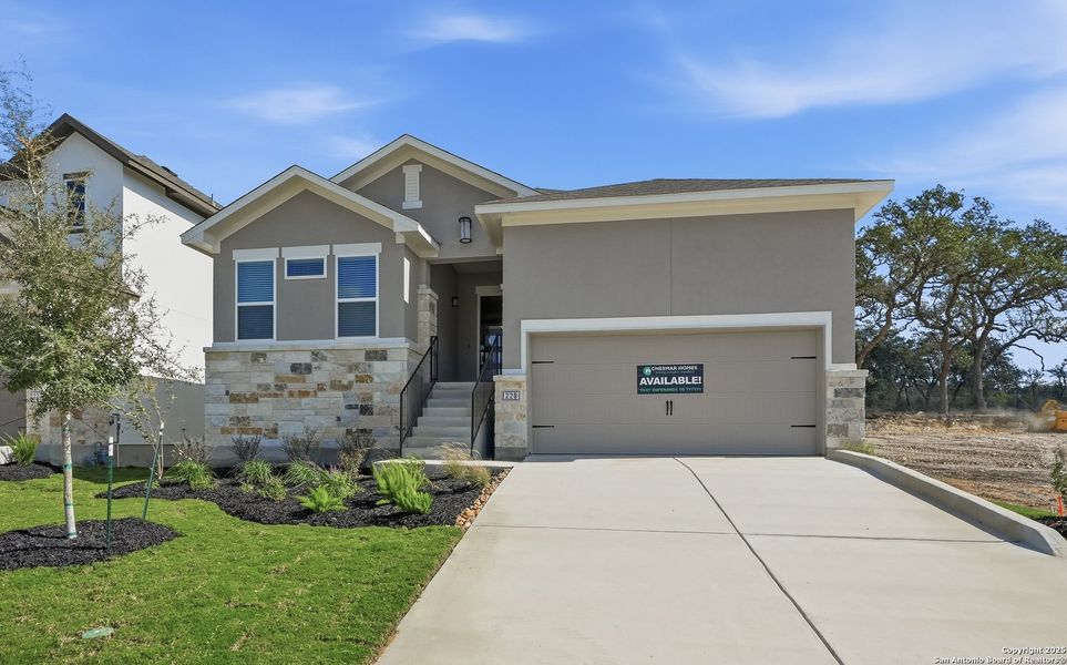 Front exterior of a new home in Esperanza – New Phase Now Selling, Boerne, TX, highlighting curb appeal (Image 1).