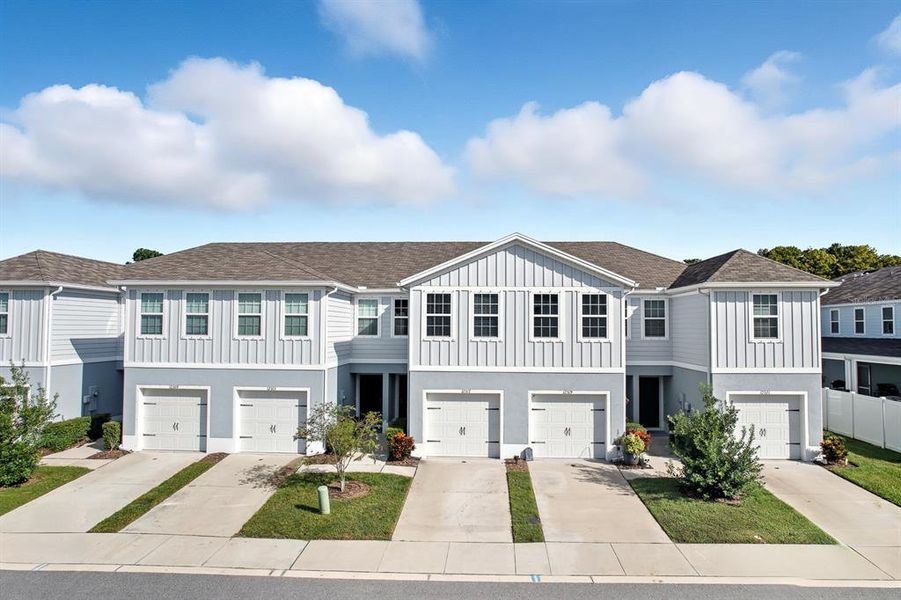 Front exterior of a new home in , New Port Richey, FL, highlighting curb appeal (Image 1).
