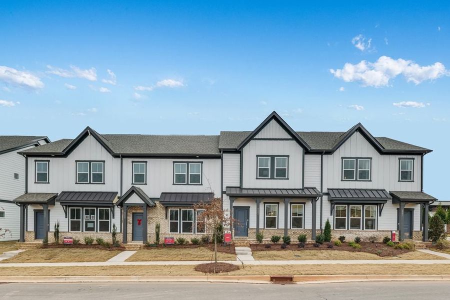 Front exterior of a new home in Terraces at the Exchange, Indian Land, SC, highlighting curb appeal (Image 2). Front exterior of a new home in Terraces at the Exchange, Indian Land, SC, highlighting curb appeal (Image 2).