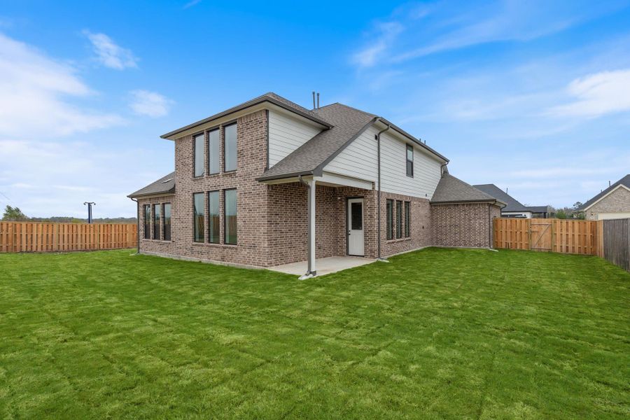 This backyard is perfect for family gatherings, social events, or simply unwinding in the fresh air.