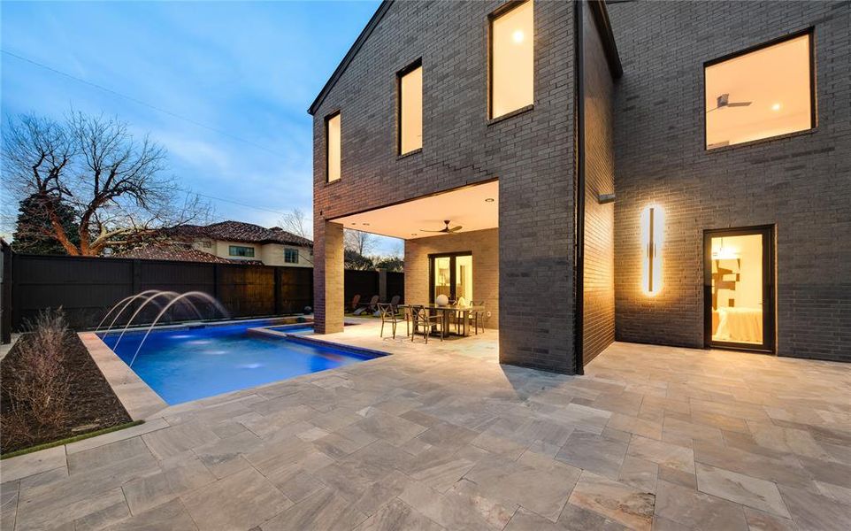 View of swimming pool with a fenced in pool, a patio, a fenced backyard, and outdoor dining space