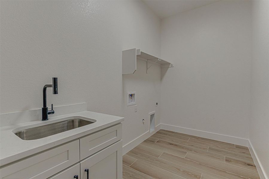 Walk-in Laundry ROOM with sink.