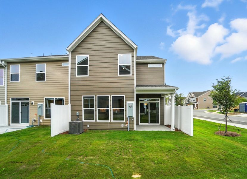Front exterior of a new home in Harrisburg Village Townhomes, Harrisburg, NC, highlighting curb appeal (Image 34). Front exterior of a new home in Harrisburg Village Townhomes, Harrisburg, NC, highlighting curb appeal (Image 34).