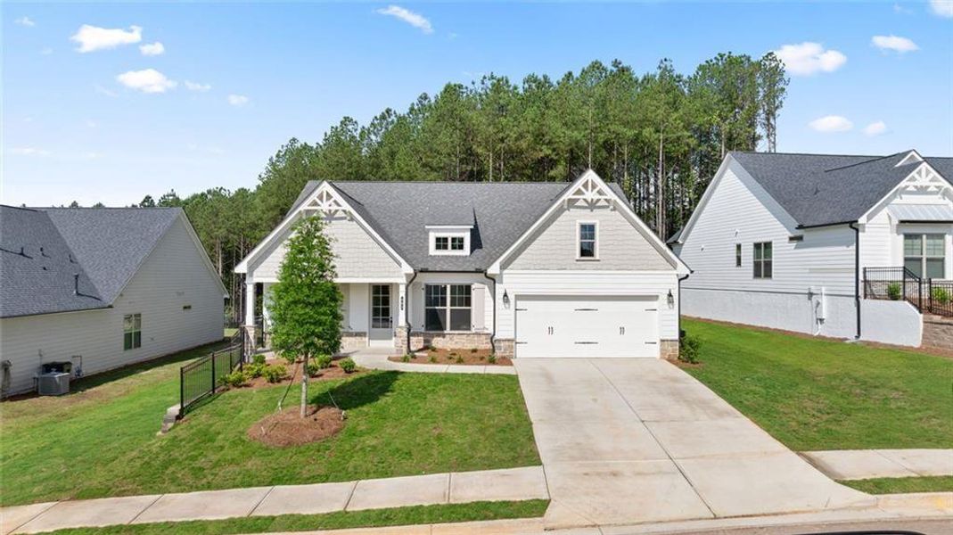 Front exterior of a new home in Soleil Belmont Park, Canton, GA, highlighting curb appeal (Image 1). Front exterior of a new home in Soleil Belmont Park, Canton, GA, highlighting curb appeal (Image 1).
