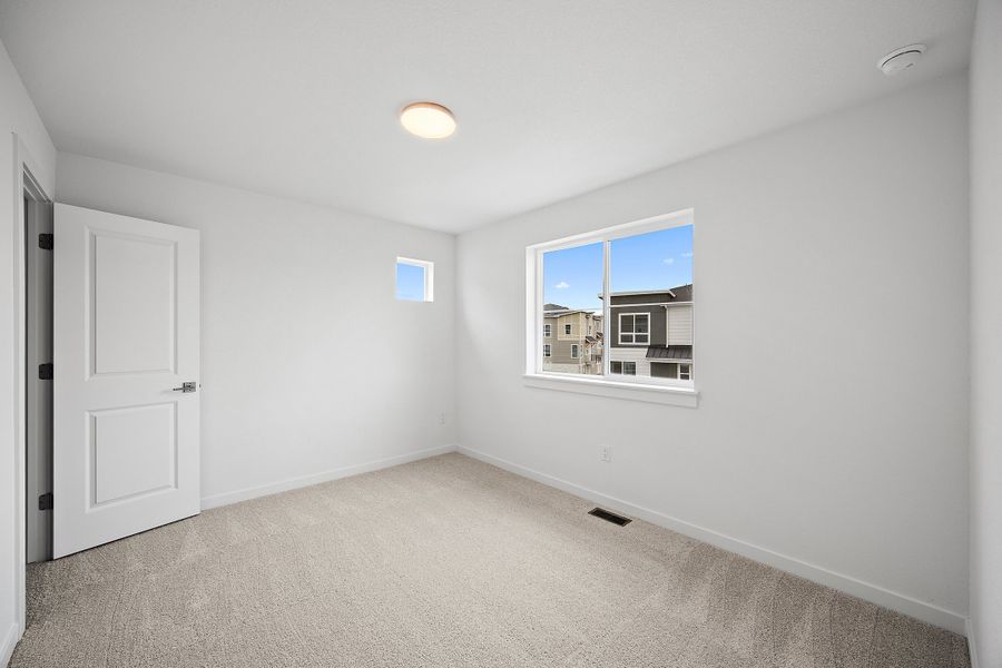 Spacious, unfurnished interior of a new home in The Commons at Victory Ridge, Colorado Springs (Image 31).