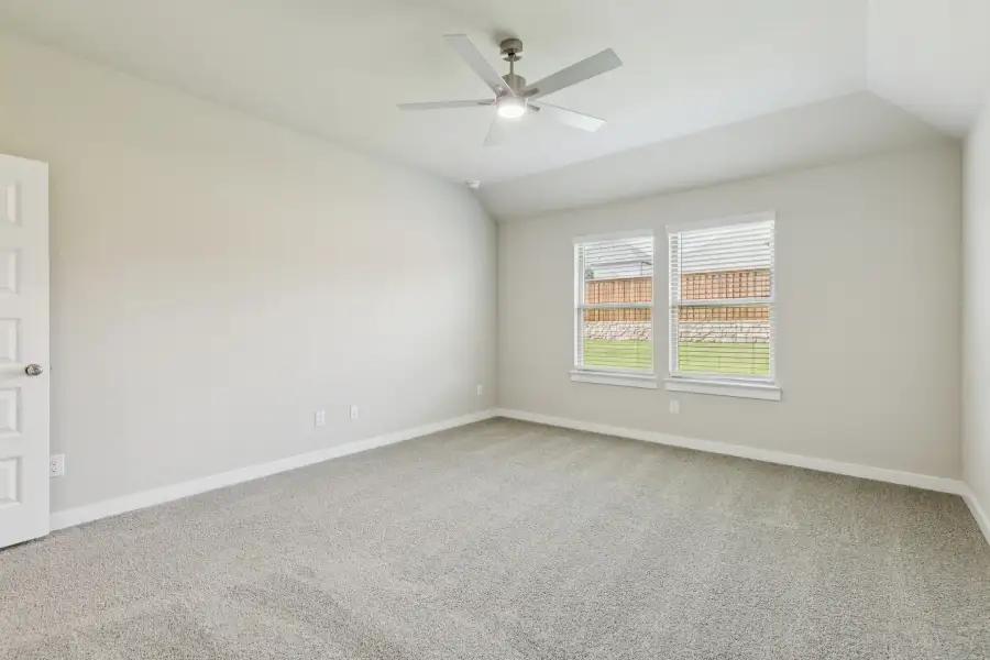 Primary Suite in the Heisman home plan by Trophy Signature Homes – REPRESENTATIVE PHOTO
