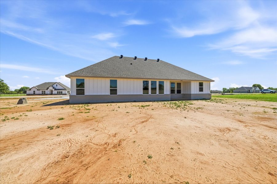Front exterior of a new home in Zion Valley, Poolville, TX, highlighting curb appeal (Image 21).