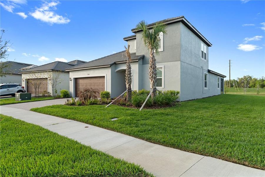Front exterior of a new home in , San Antonio, FL, highlighting curb appeal (Image 1). Front exterior of a new home in , San Antonio, FL, highlighting curb appeal (Image 1).